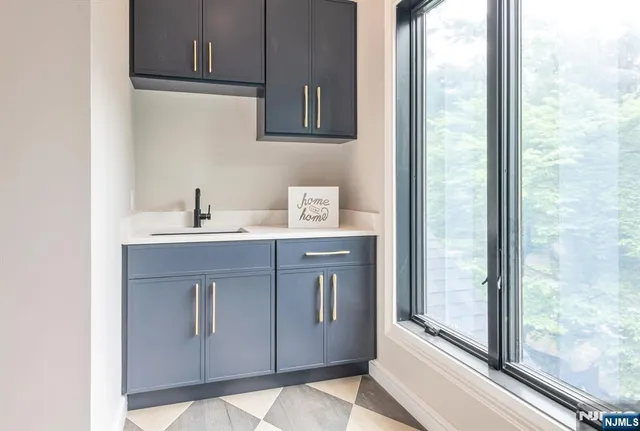 a bathroom with a sink vanity and a mirror