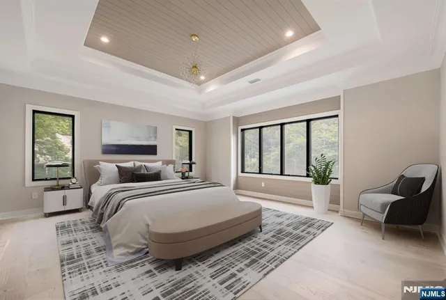 a spacious bedroom with a large bed and windows