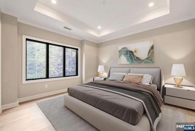 a bedroom with a large bed and a window