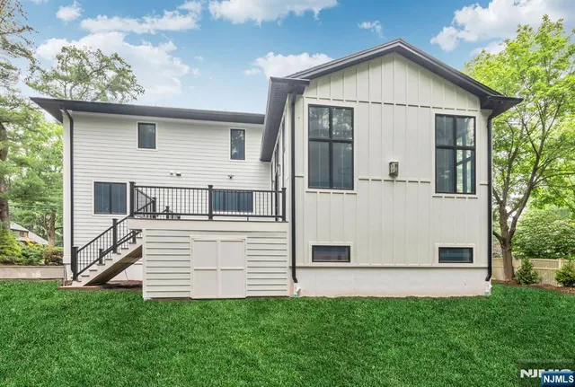 a view of house with backyard