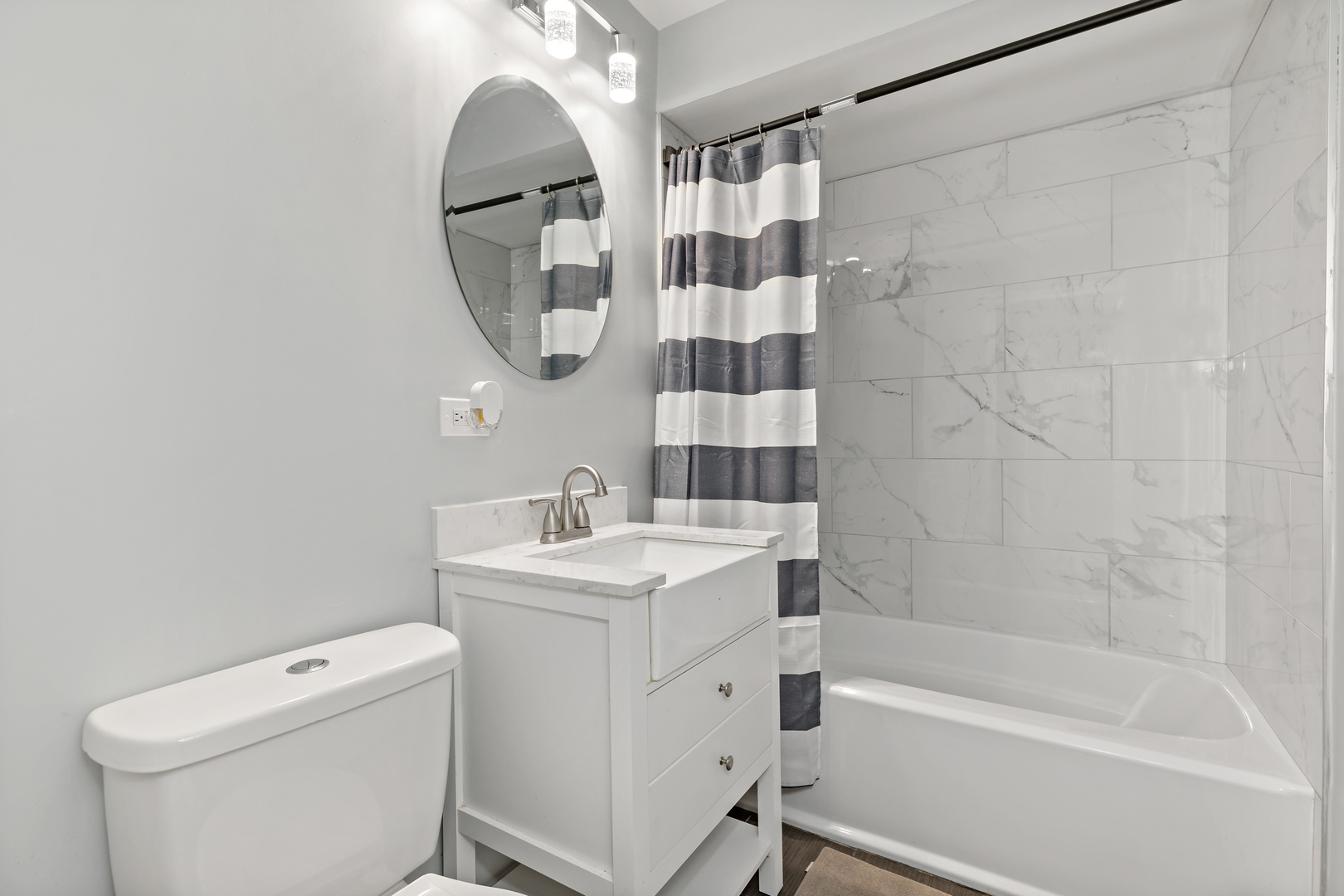 9211 South Cottage Grove Avenue, Unit 9C2 Chicago, IL 60619 - Photo 9 of 9 a bathroom with a sink toilet and shower