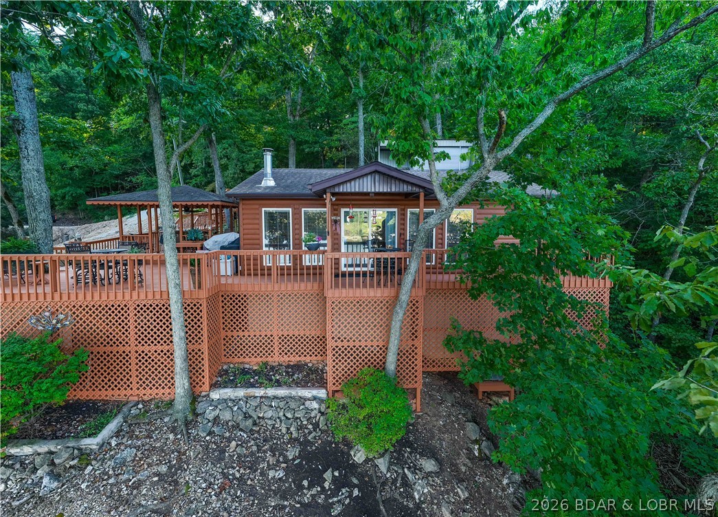 30501 Buchanan Road Stover, MO 65078 - Photo 3 of 80 lake view of the beautiful cabin nestled in the tr