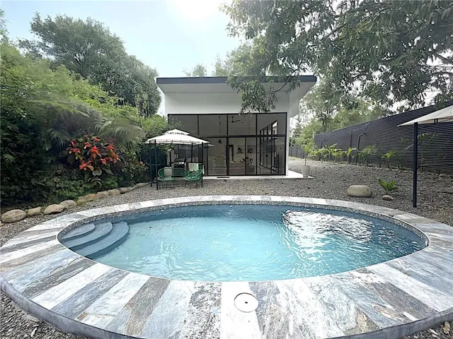 a view of a swimming pool with a patio