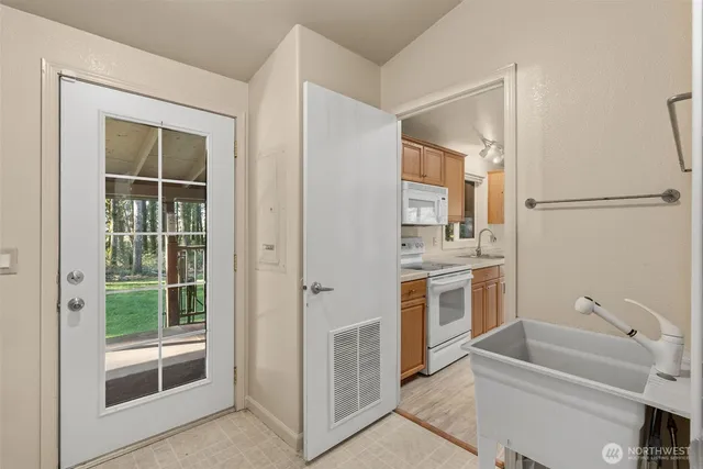a view of room with window and cabinet