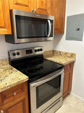 a kitchen with a stove and a microwave
