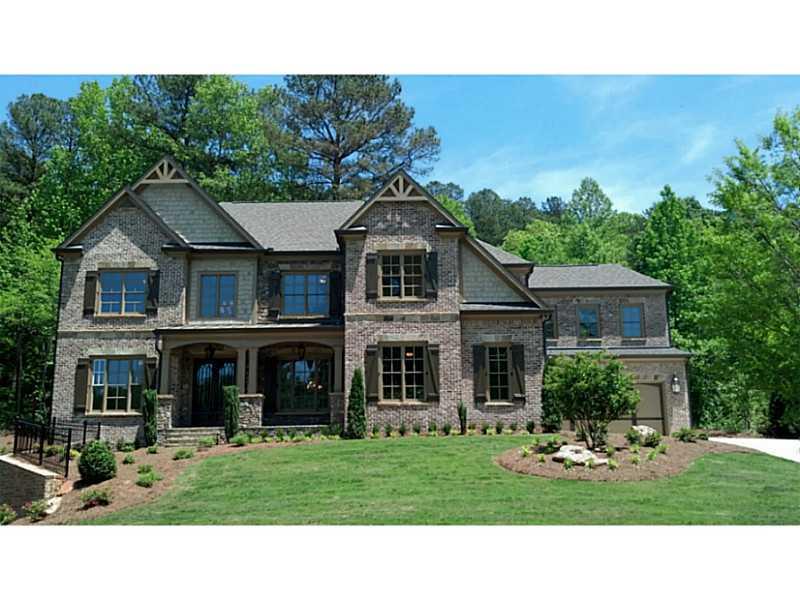 Exterior Front. Classic brick and hand-cut stone elevation with front porch and 4-car garage on 1.7 acres in prestigious Hampton Manor.