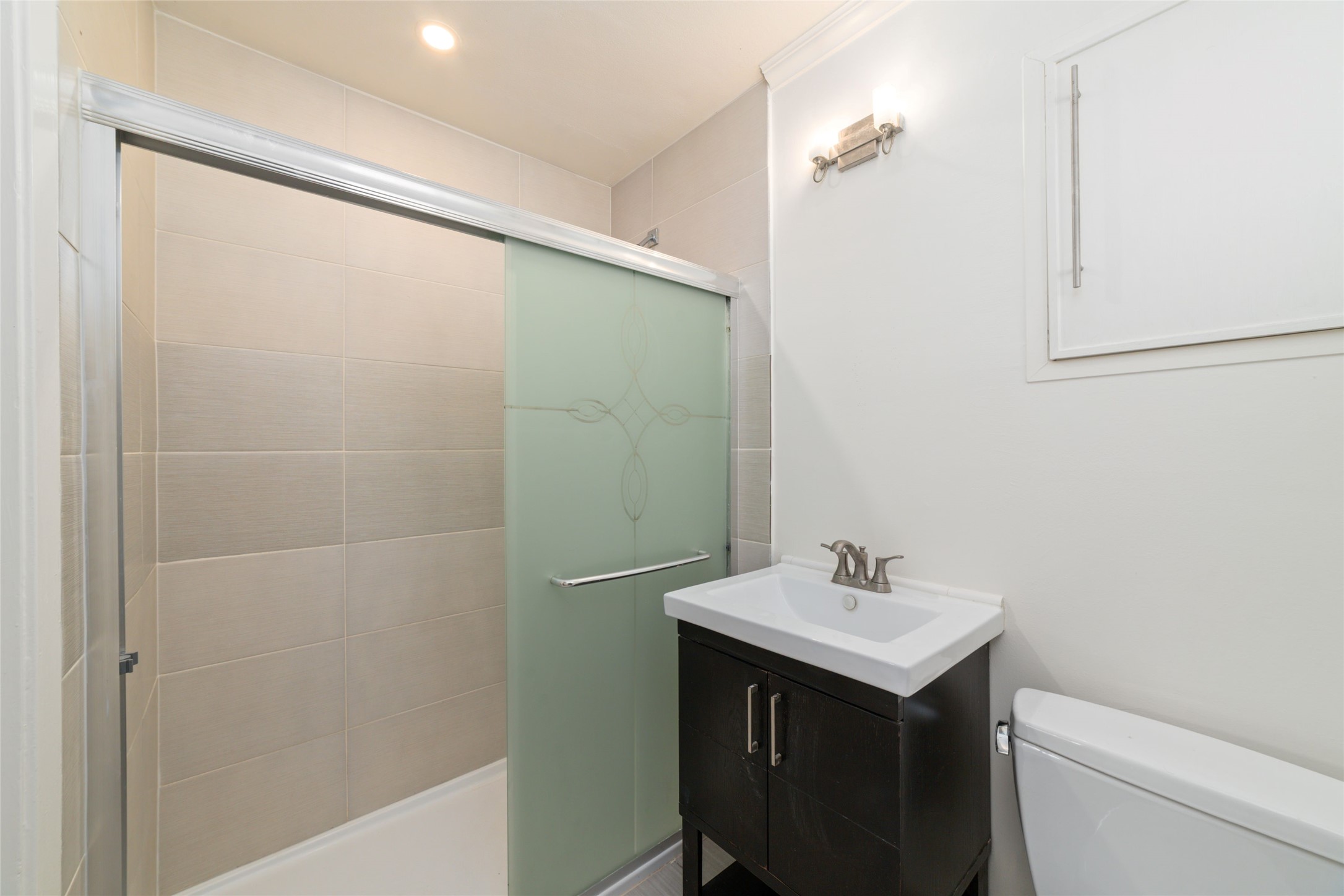 4415 Merwin Street Houston, TX 77027 - Photo 17 of 18 a bathroom with a sink and a mirror