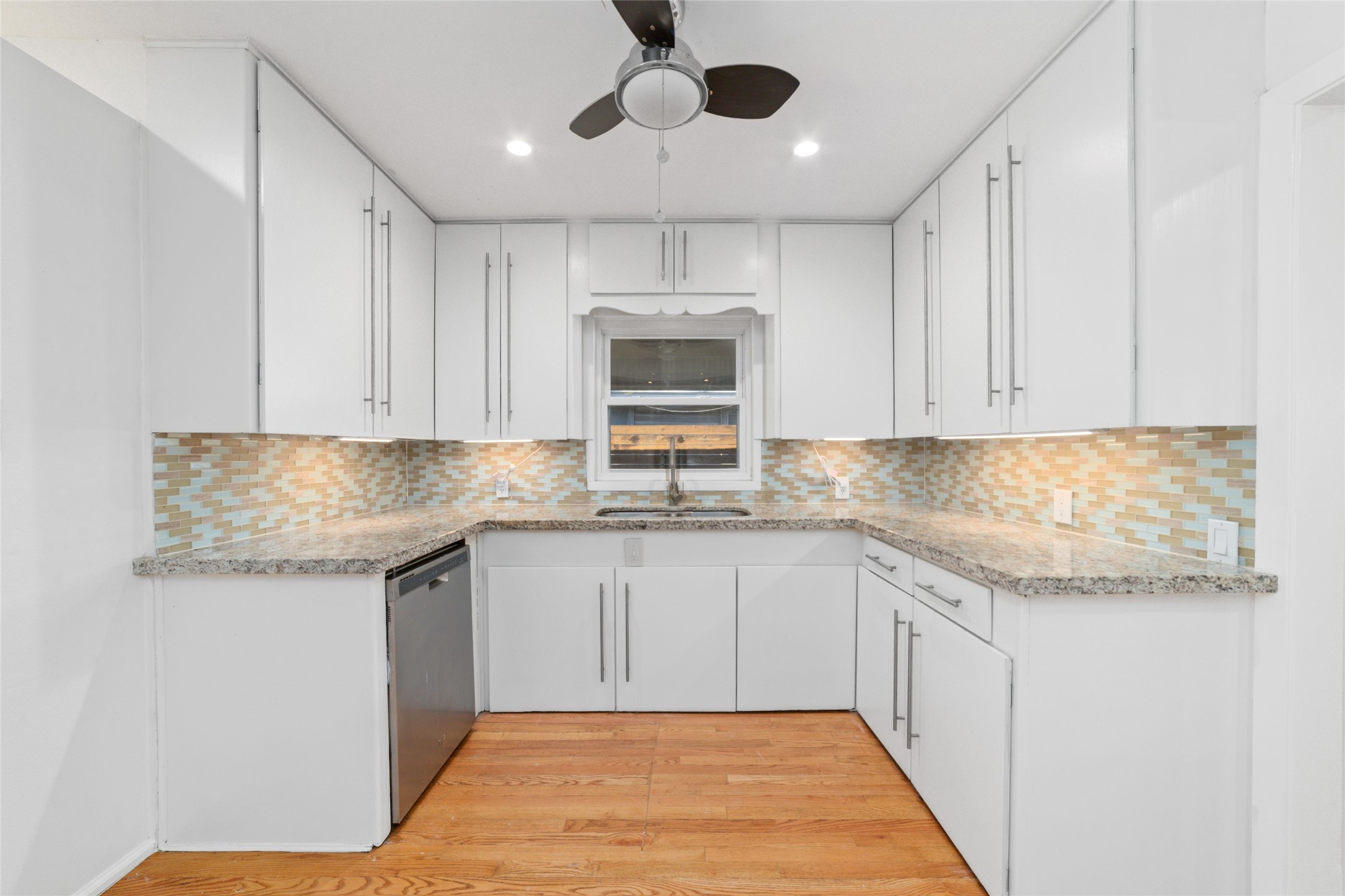 4415 Merwin Street Houston, TX 77027 - Photo 5 of 18 a kitchen with granite countertop cabinets stainless steel appliances and a sink