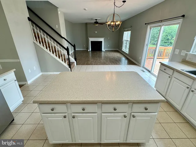 a view of a kitchen with furniture and a fireplace