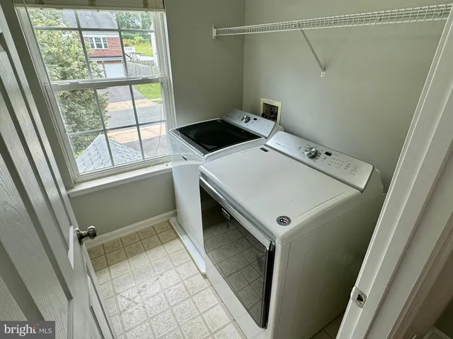 a utility room with washer and dryer