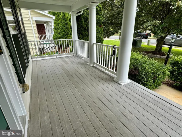 a view of a balcony with wooden floor