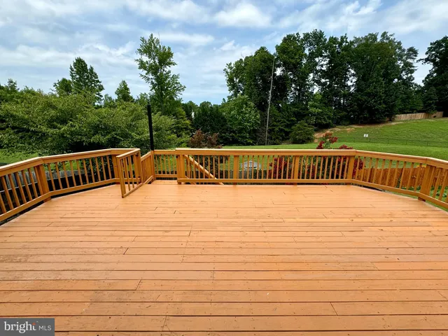 a view of balcony with deck and outdoor space