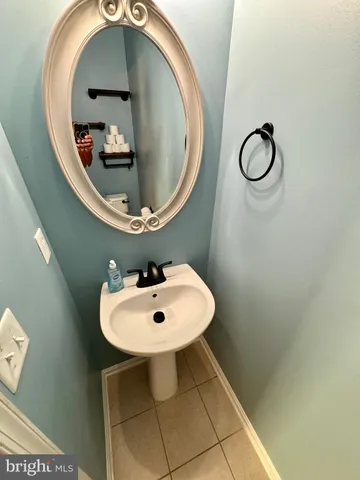 a bathroom with a sink and mirror