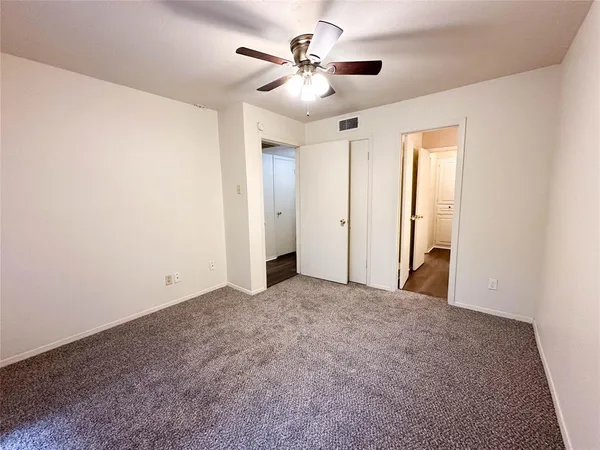 a view of a livingroom with a ceiling fan