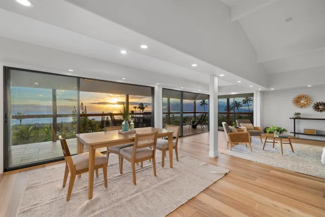 a dining room with furniture wooden floor and a rug