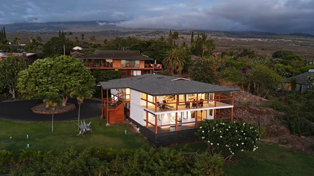 an aerial view of a house with a garden