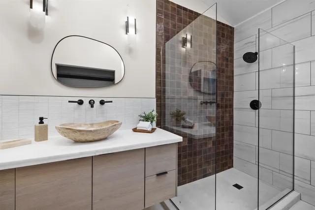 a bathroom with a sink and a mirror