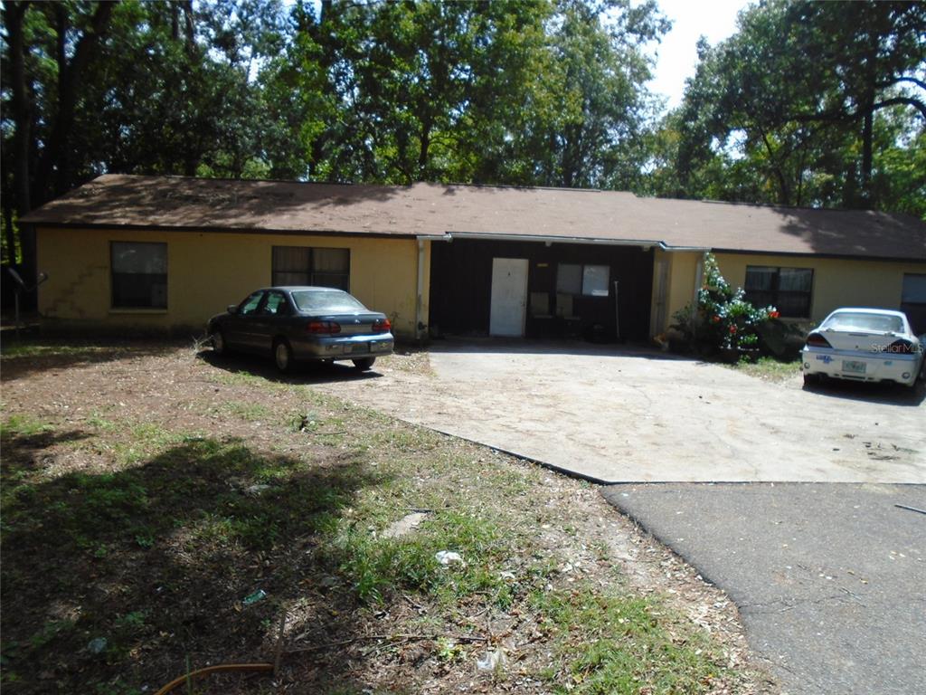 4021 Southwest 37 Street, Unit C Gainesville, FL 32608 - Photo 1 of 25 a front view of a house with a yard