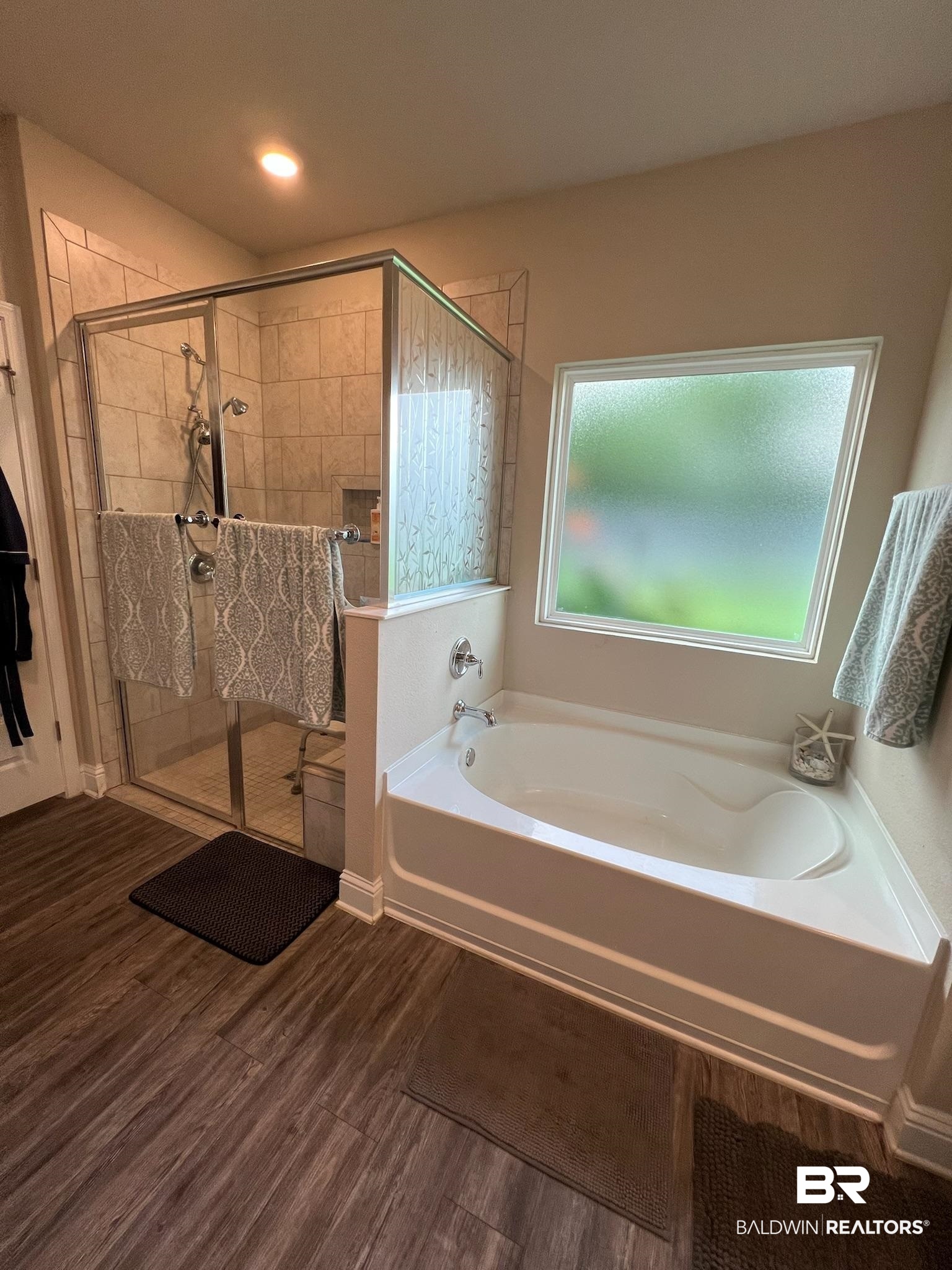 3904 Conrad Court Gulf Shores, AL 36542 - Photo 12 of 24 Bathroom with wood-type flooring and independent shower and bath