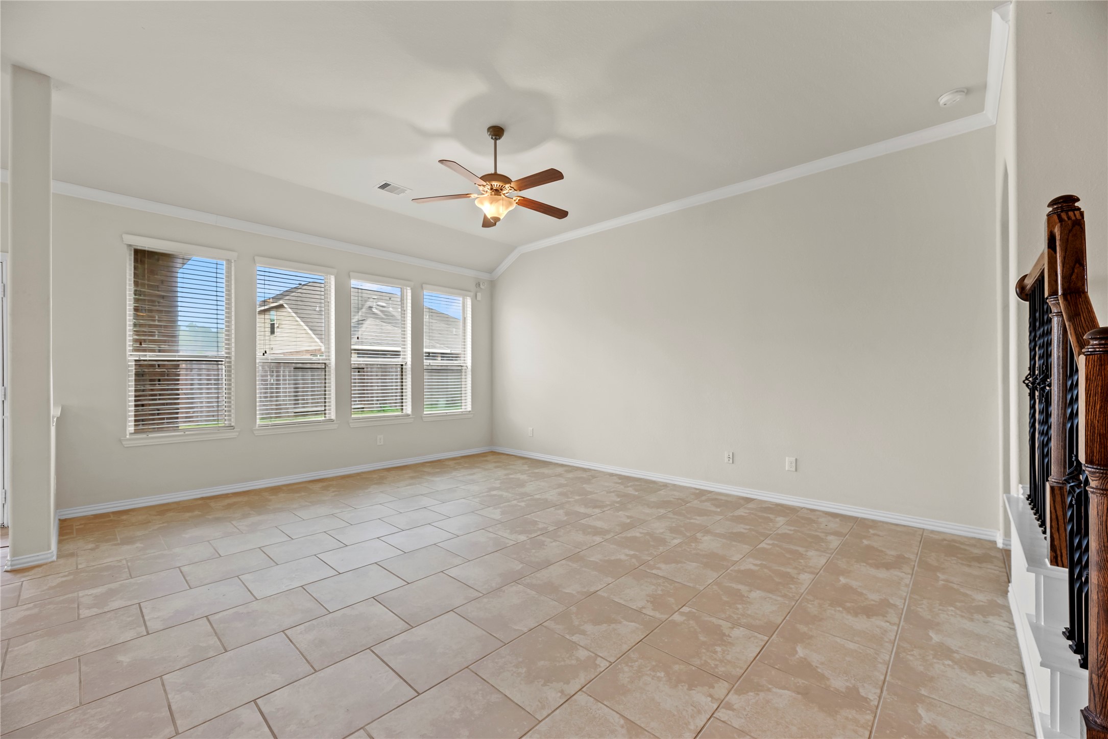 5205 Rainy Garden Court Rosharon, TX 77583 - Photo 12 of 43 an empty room with windows and ceiling fan