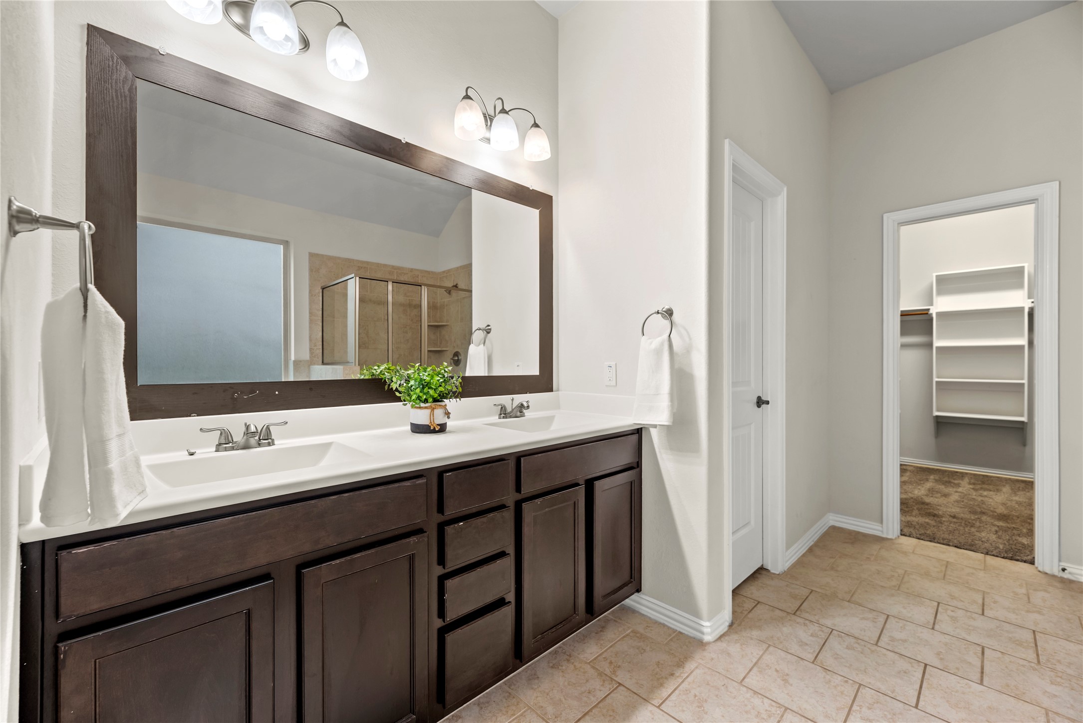 5205 Rainy Garden Court Rosharon, TX 77583 - Photo 15 of 43 a bathroom with a double vanity sink and a mirror