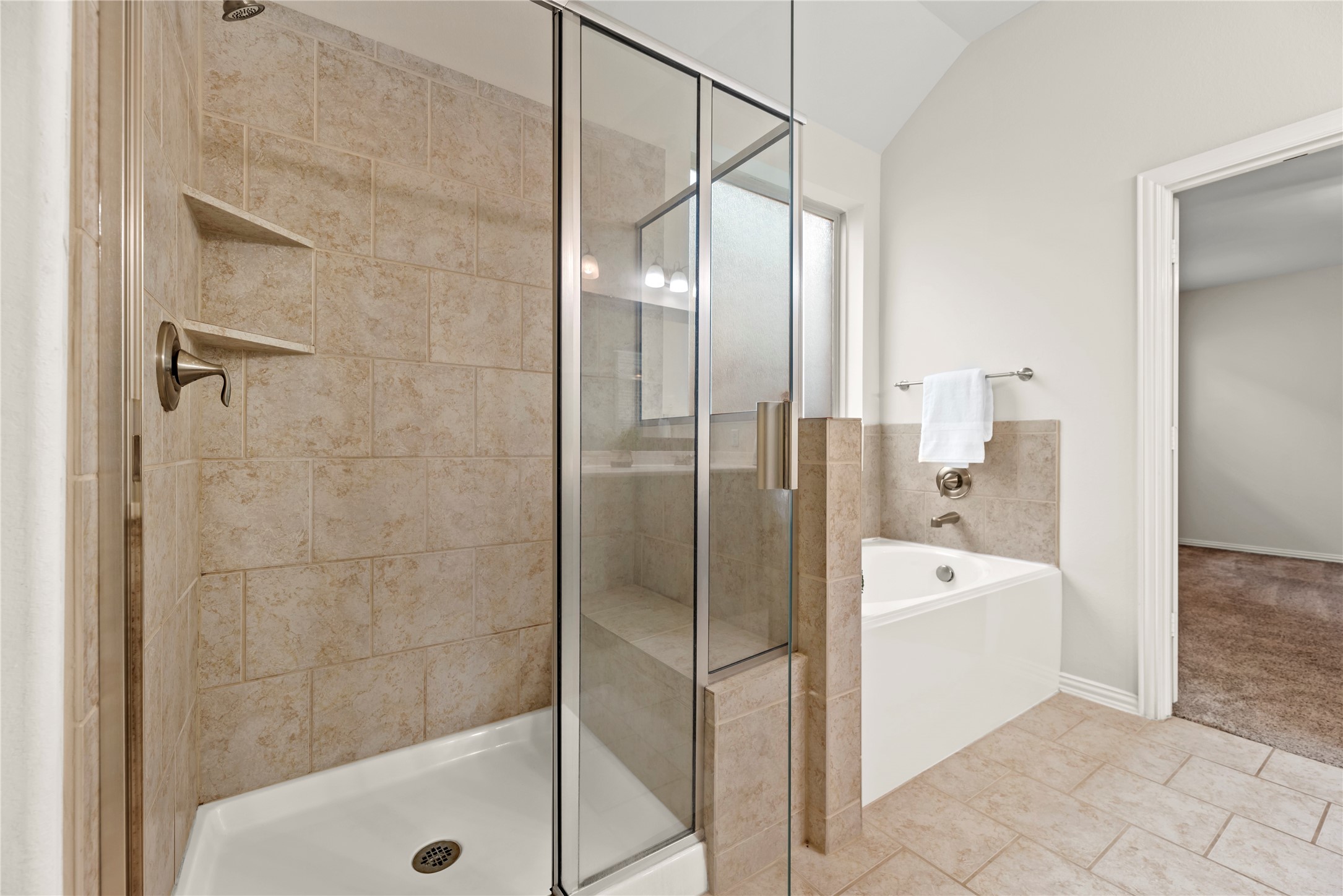 5205 Rainy Garden Court Rosharon, TX 77583 - Photo 17 of 43 a bathroom with a bathtub and a shower