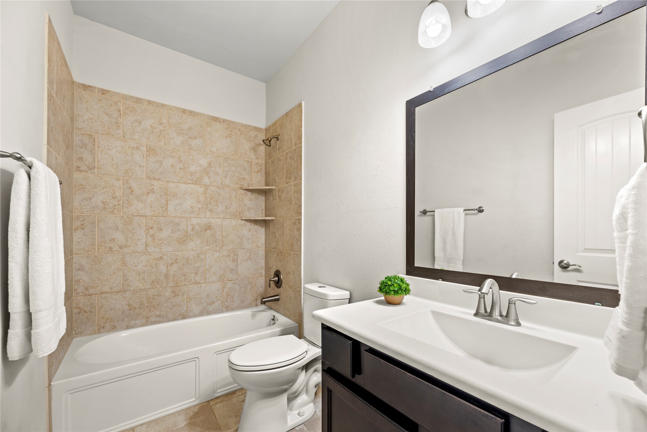 5205 Rainy Garden Court Rosharon, TX 77583 - Photo 22 of 43 a bathroom with a sink a toilet and bathtub