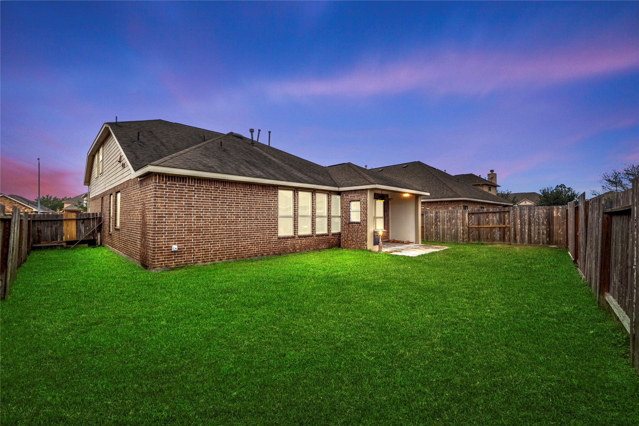 5205 Rainy Garden Court Rosharon, TX 77583 - Photo 36 of 43 a view of a yard with a house in the background