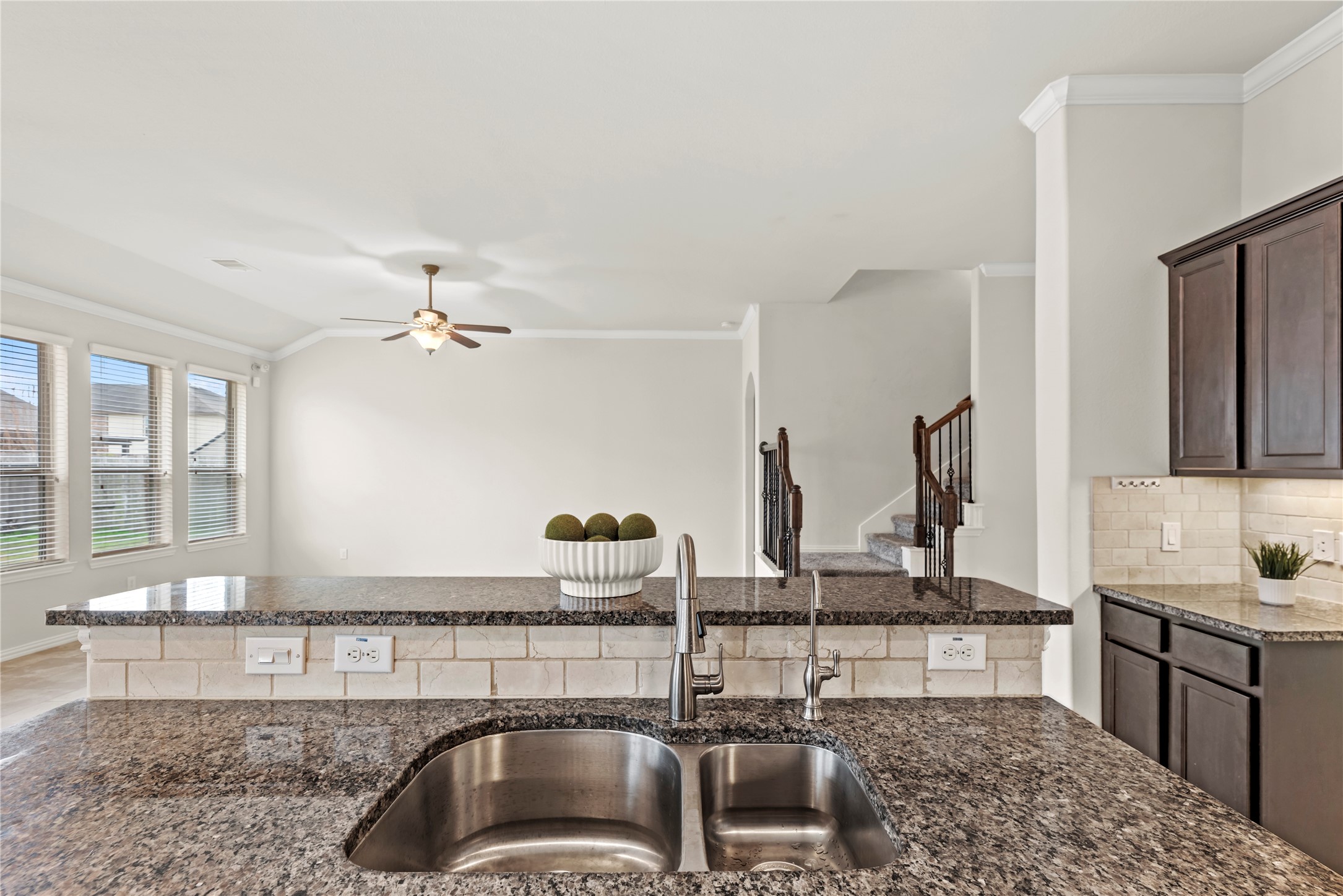 5205 Rainy Garden Court Rosharon, TX 77583 - Photo 7 of 43 a kitchen with a sink and a stove top oven