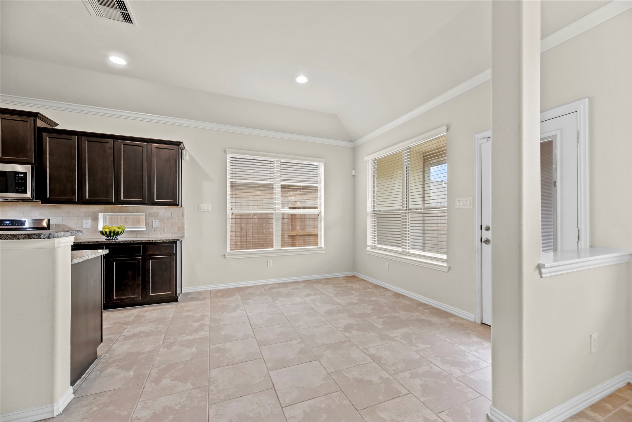 5205 Rainy Garden Court Rosharon, TX 77583 - Photo 9 of 43 a kitchen with stainless steel appliances granite countertop a stove a sink and a refrigerator