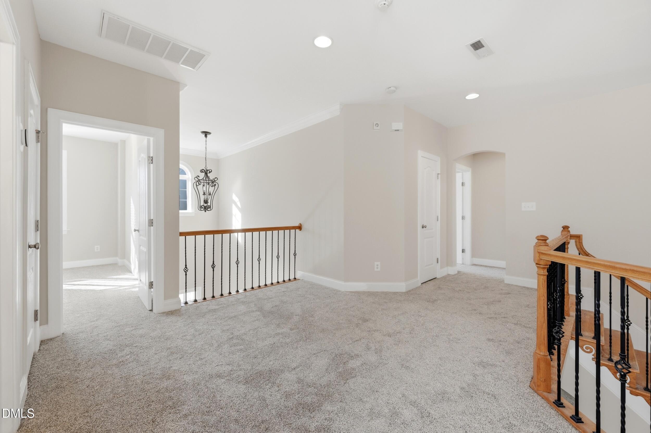 4803 Marena Place Durham, NC 27707 - Photo 22 of 42 a view of a hallway with entryway and stairs