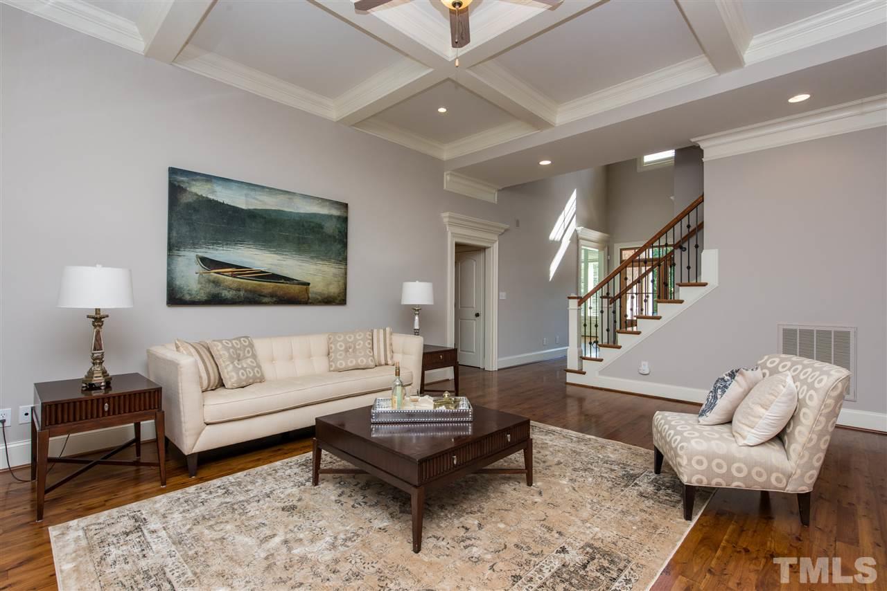 3003 Greyhawk Place Apex, NC 27539 - Photo 11 of 25 a living room with furniture and a potted plant
