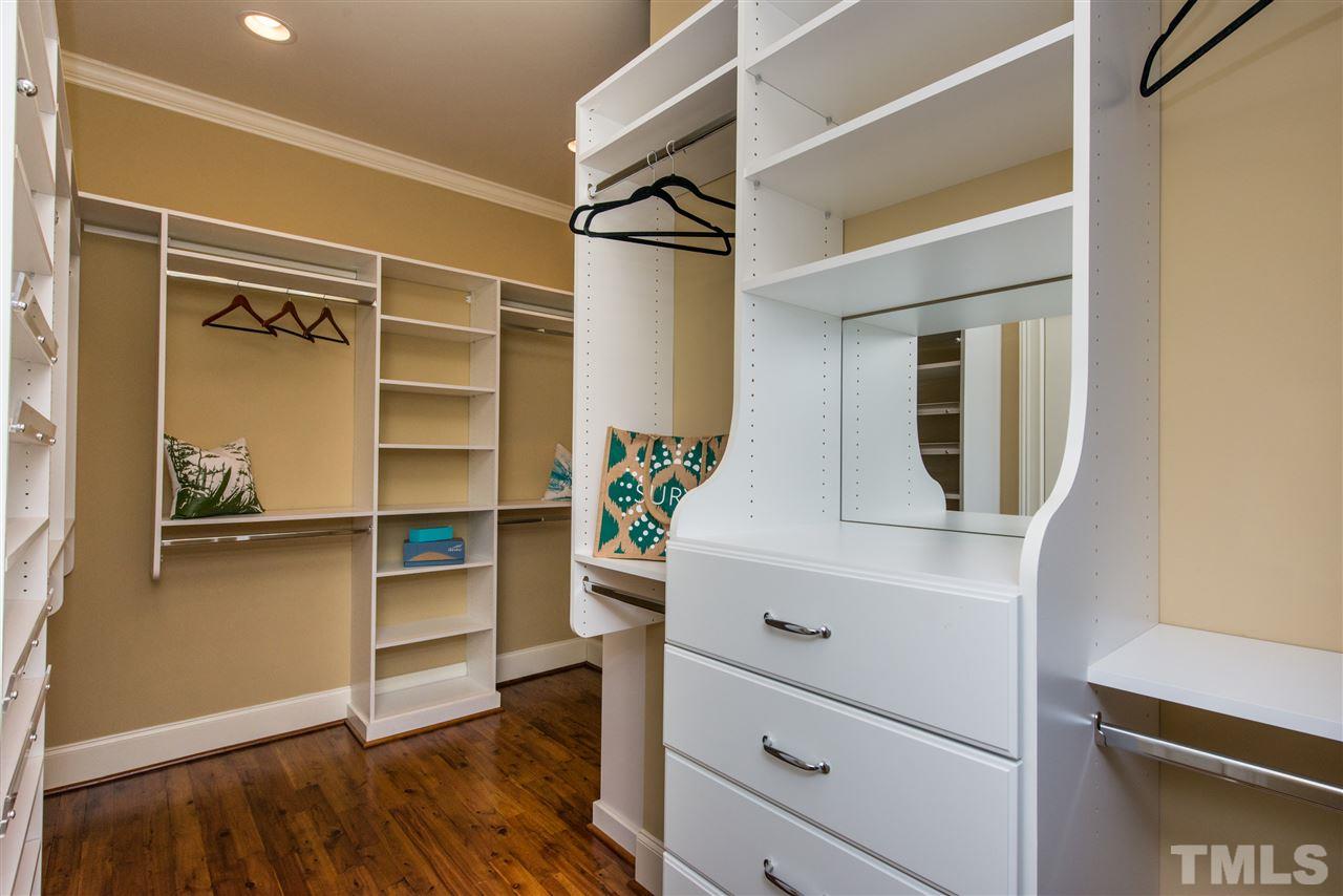 3003 Greyhawk Place Apex, NC 27539 - Photo 14 of 25 a view of walk in closet with empty racks