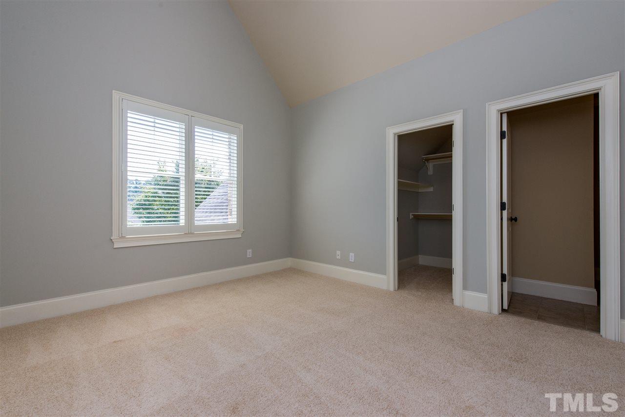 3003 Greyhawk Place Apex, NC 27539 - Photo 16 of 25 an empty room with windows and closet