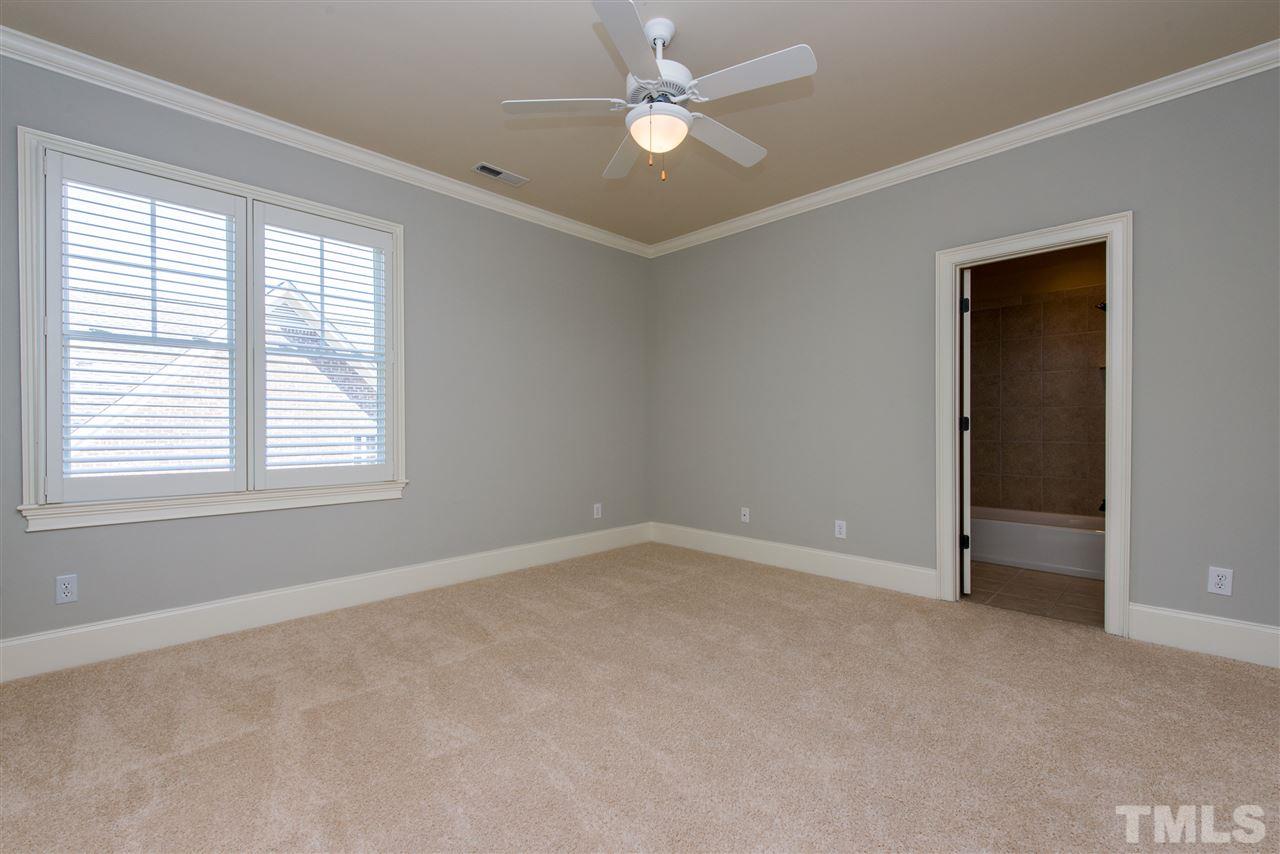 3003 Greyhawk Place Apex, NC 27539 - Photo 17 of 25 an empty room with a window and a fan