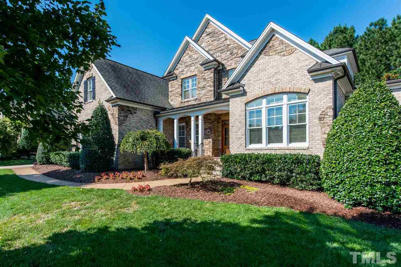 3003 Greyhawk Place Apex, NC 27539 - Photo 25 of 25 a view of a house with backyard sitting area and garden