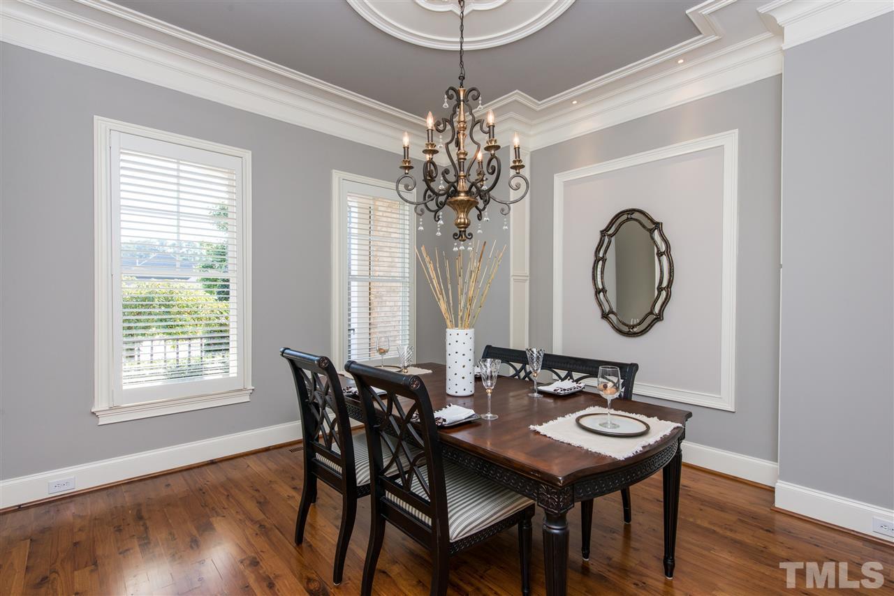 3003 Greyhawk Place Apex, NC 27539 - Photo 5 of 25 a view of a dining room with furniture window and wooden floor