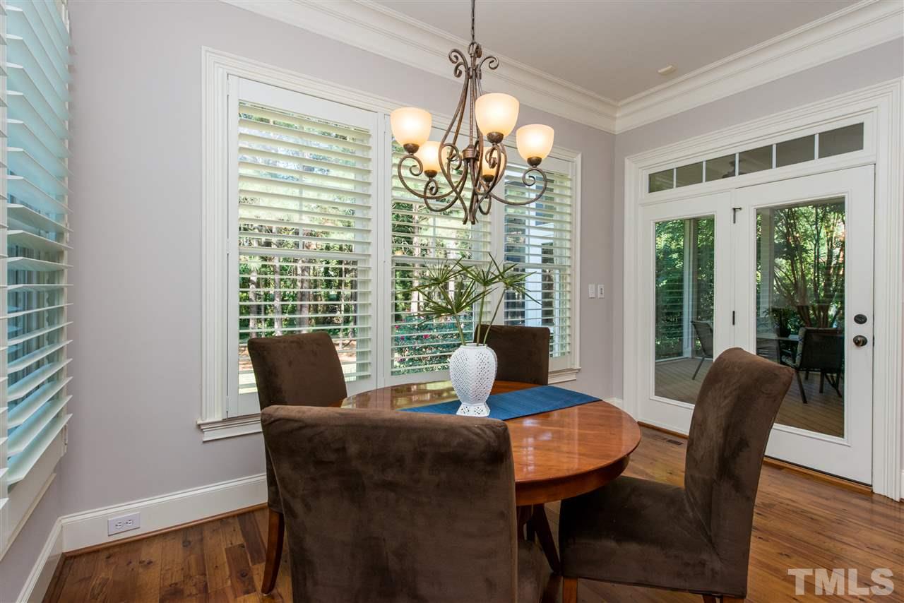 3003 Greyhawk Place Apex, NC 27539 - Photo 9 of 25 a view of a dining room with furniture window and outside view