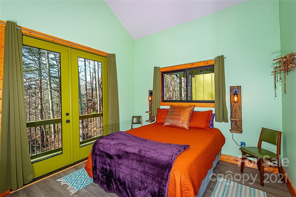 241 Ray Hill Road Horse Shoe, NC 28742 - Photo 13 of 43 a bedroom with a bed and a window