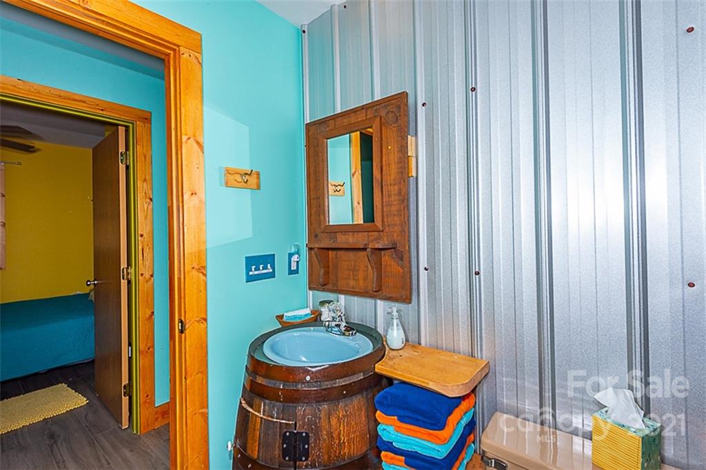 241 Ray Hill Road Horse Shoe, NC 28742 - Photo 19 of 43 a bathroom with a sink and a mirror