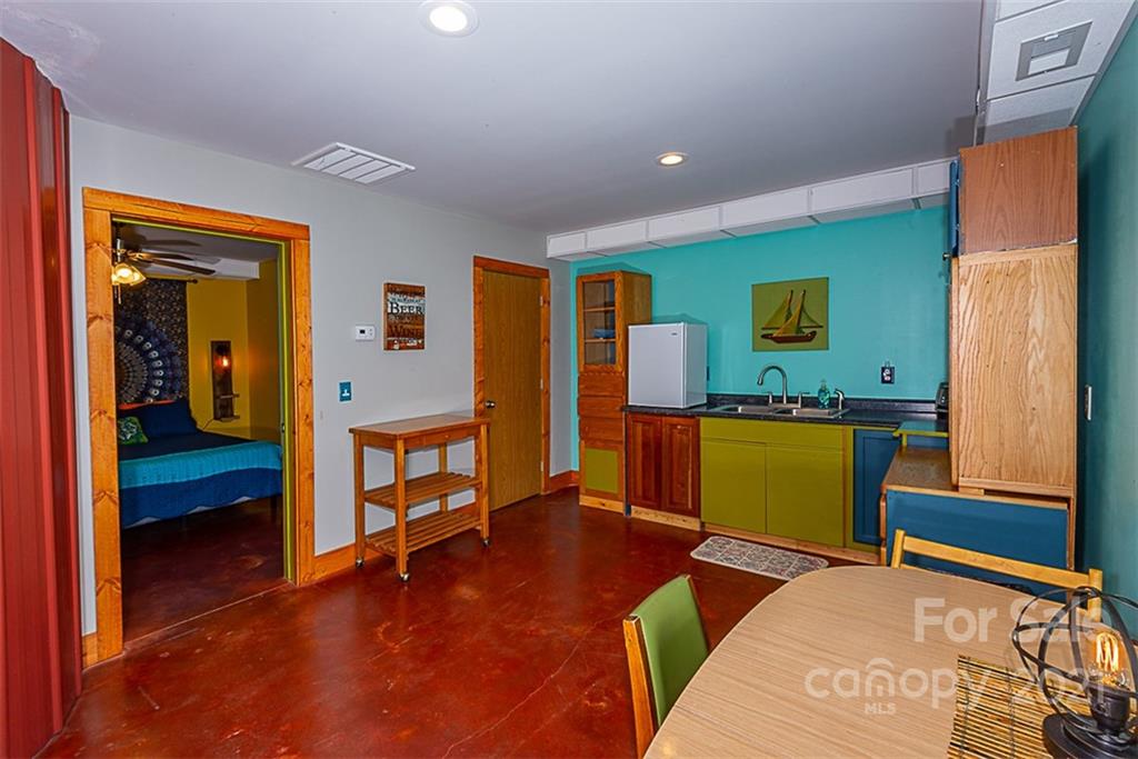 241 Ray Hill Road Horse Shoe, NC 28742 - Photo 25 of 43 a bedroom with furniture and a window