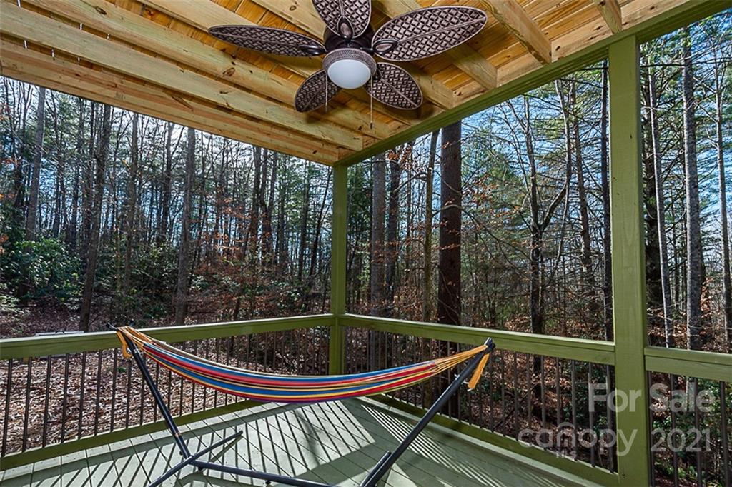 241 Ray Hill Road Horse Shoe, NC 28742 - Photo 30 of 43 a view of a roof deck with couches and wooden floor