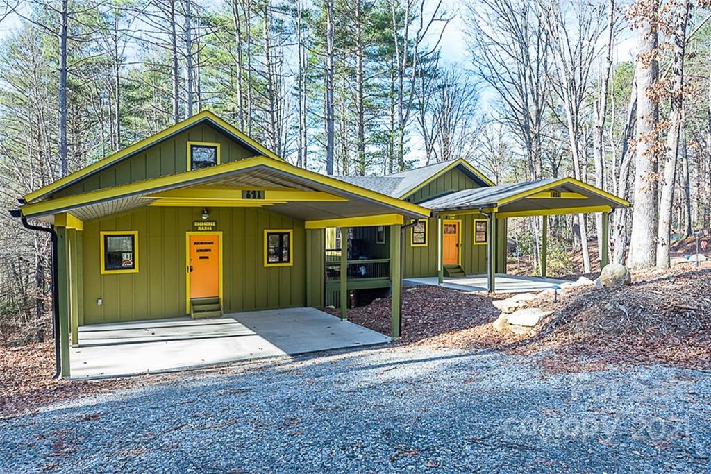 241 Ray Hill Road Horse Shoe, NC 28742 - Photo 3 of 43 a front view of a house with a yard and porch