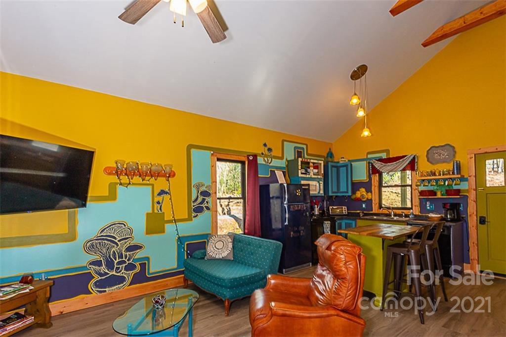 241 Ray Hill Road Horse Shoe, NC 28742 - Photo 37 of 43 a living room with furniture and kitchen view