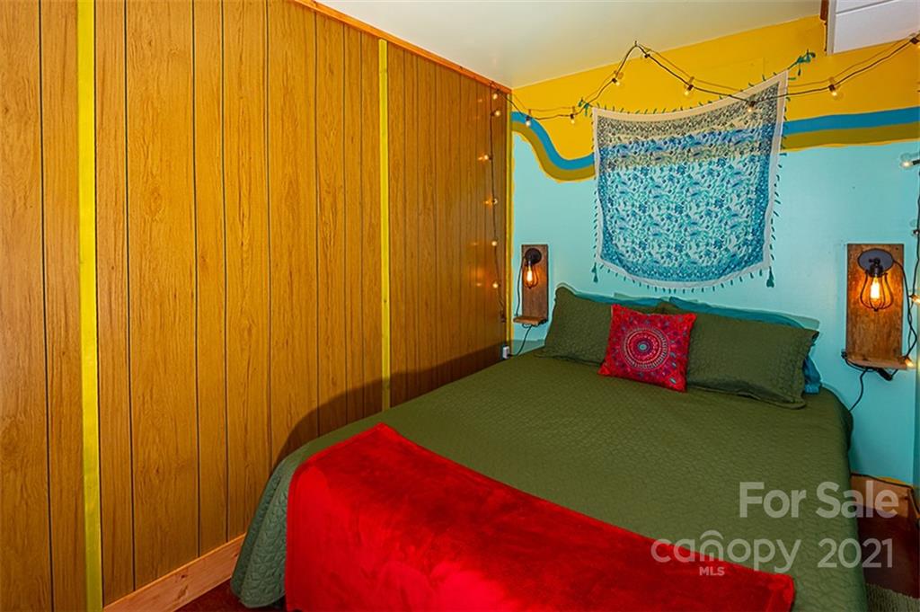 241 Ray Hill Road Horse Shoe, NC 28742 - Photo 42 of 43 a bedroom with a bed and a window