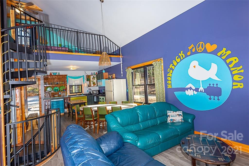 241 Ray Hill Road Horse Shoe, NC 28742 - Photo 10 of 43 a living room with furniture and a wooden floor