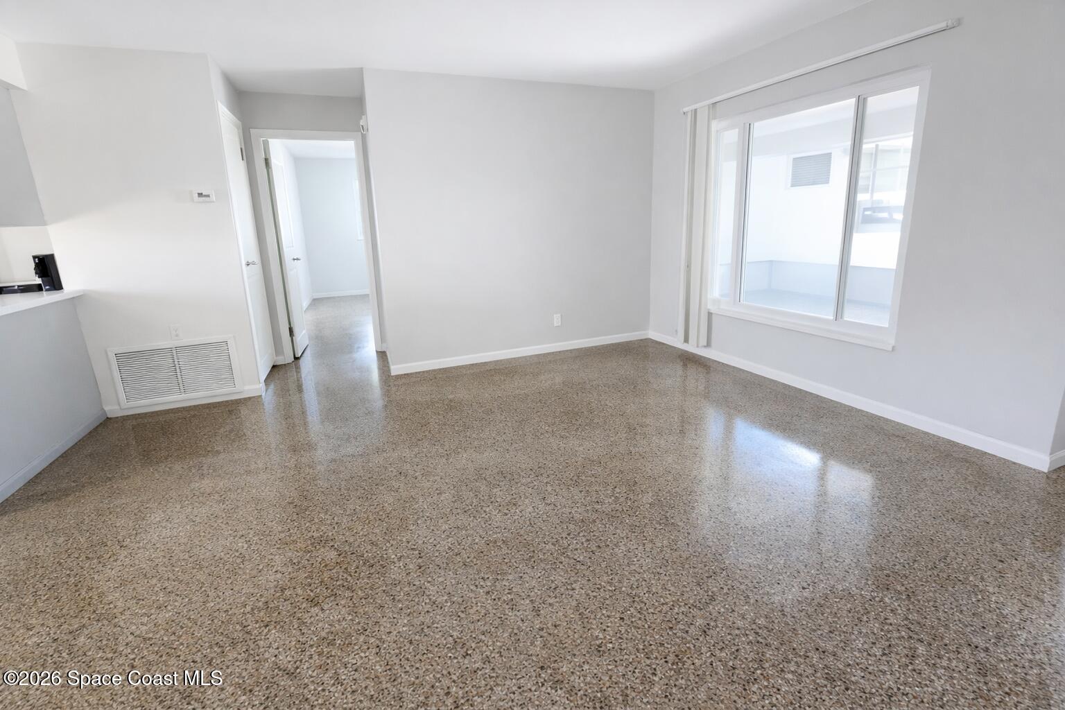 1336 Estridge Drive Rockledge, FL 32955 - Photo 2 of 11 an empty room with windows and entrance