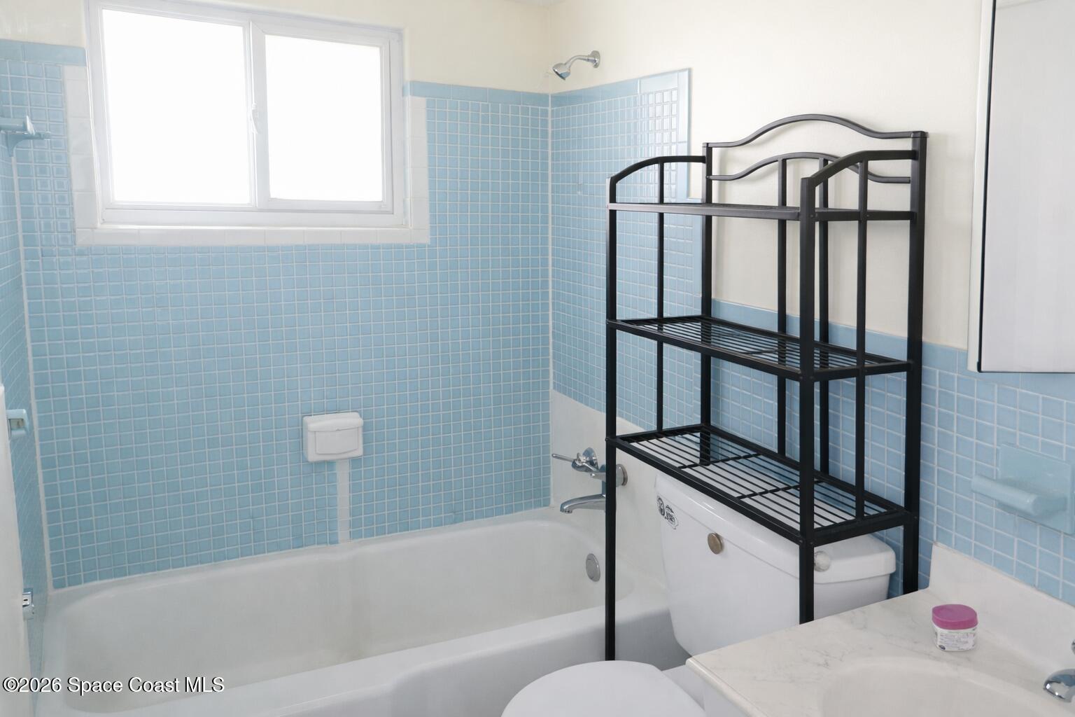 1336 Estridge Drive Rockledge, FL 32955 - Photo 7 of 11 a bathroom with a bathtub and shower