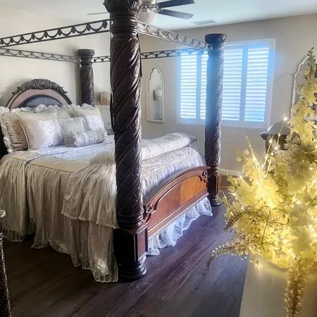 a view of a hallway with wooden floor and closet