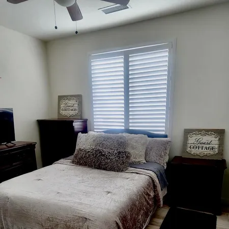 a bathroom with a toilet and a mirror